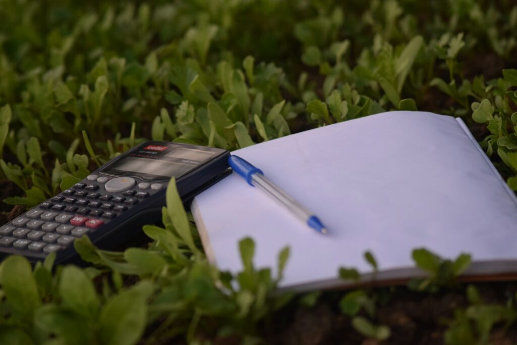 Items used to count budgets, showing practical steps to travel sustainably in a budget