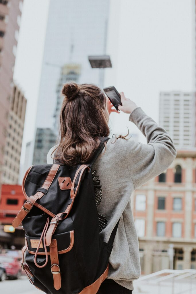 A tourist having fun in a city, exploring the ins and outs.